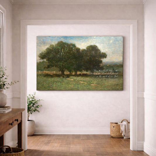 a large painting of a serene landscape with a group of trees in the foreground and a grassy field in the background. The painting is hung on a white wall in a room with a wooden floor.