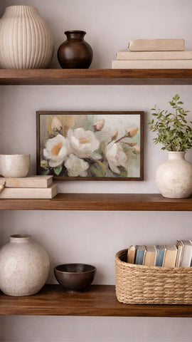 a well-organized bookshelf with various decorative items and books arranged neatly on the shelves.