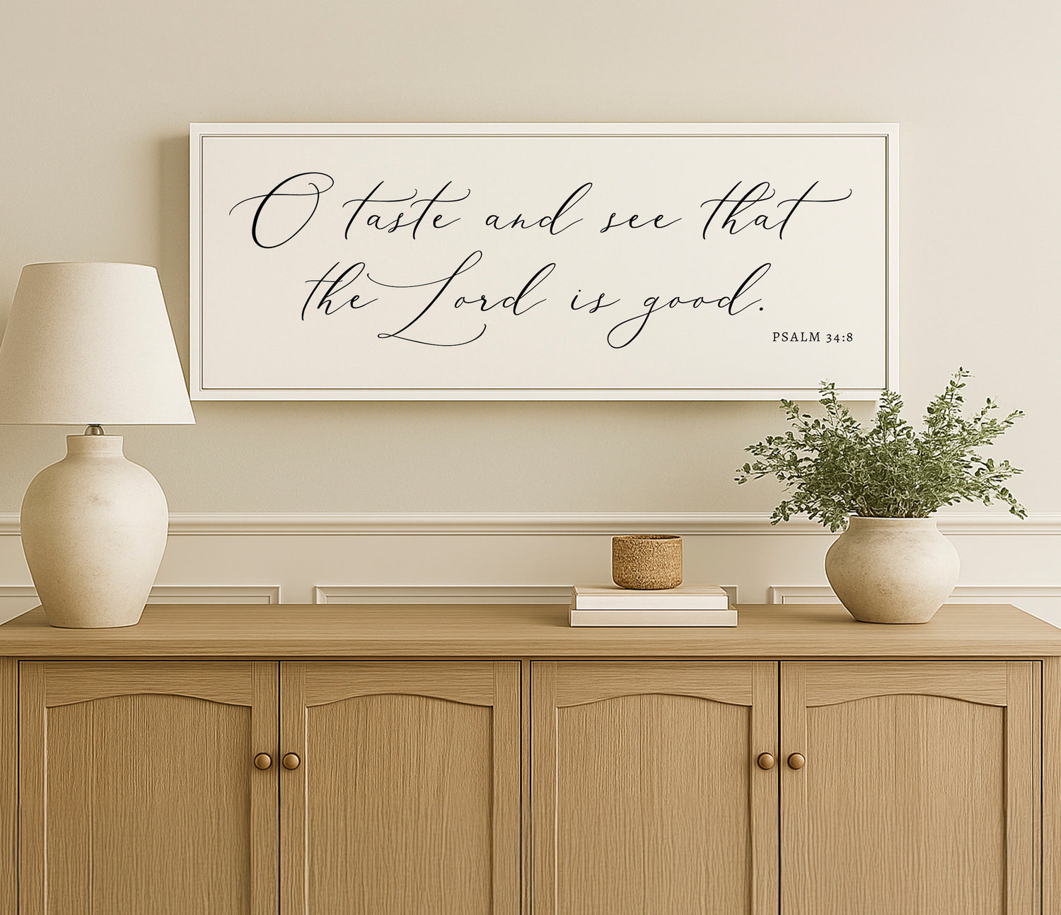 a picture of a vase and a lamp on a dresser