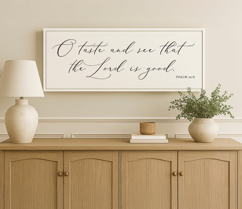 a picture of a vase and a lamp on a dresser