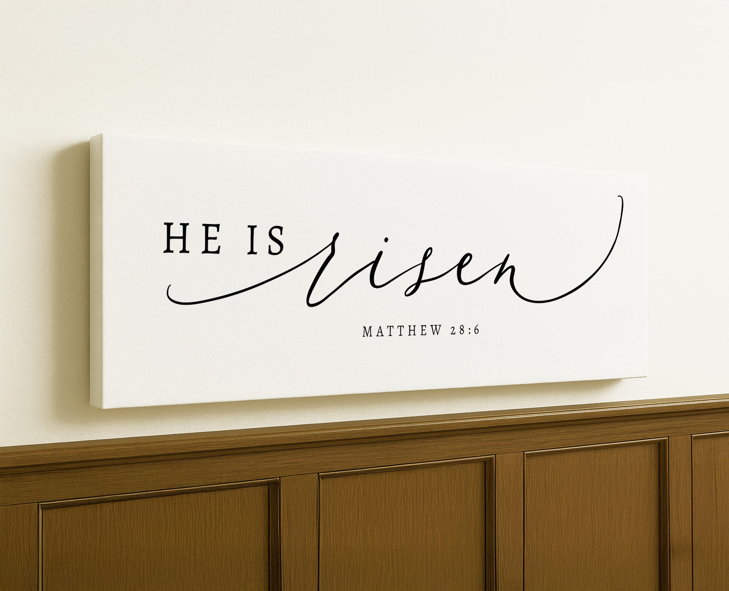 a white canvas with the word he is risen on it