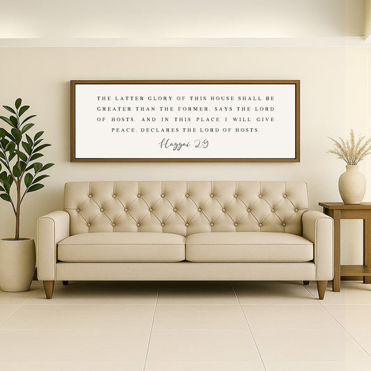 a living room with a couch and potted plant