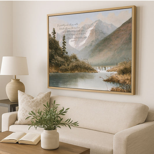 a large landscape painting hanging on a wall above a beige sofa, with a lamp and a plant in the foreground.