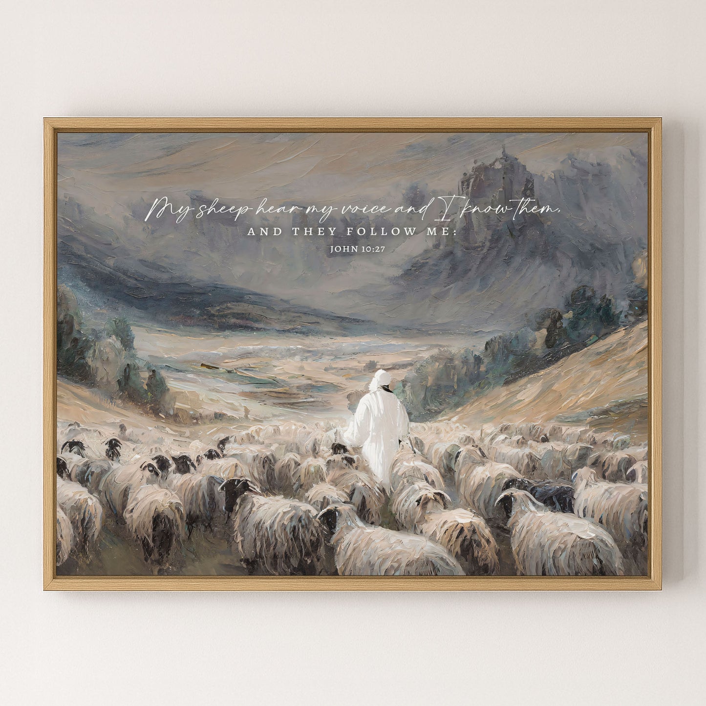 a shepherd tending to his flock of sheep in a mountainous landscape.