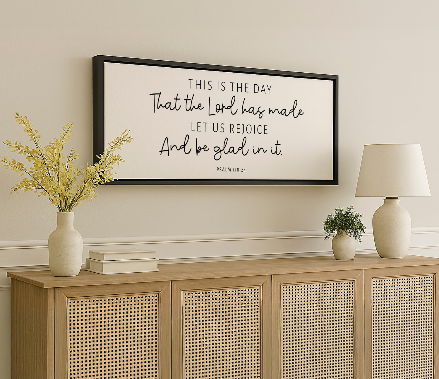 a picture hanging on a wall above a dresser