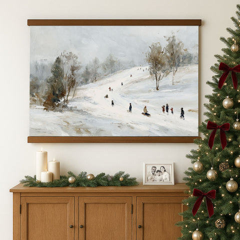 a cozy Christmas scene with a framed painting of people skiing on a snowy hill, a decorated Christmas tree, and a wooden cabinet with holiday decorations.