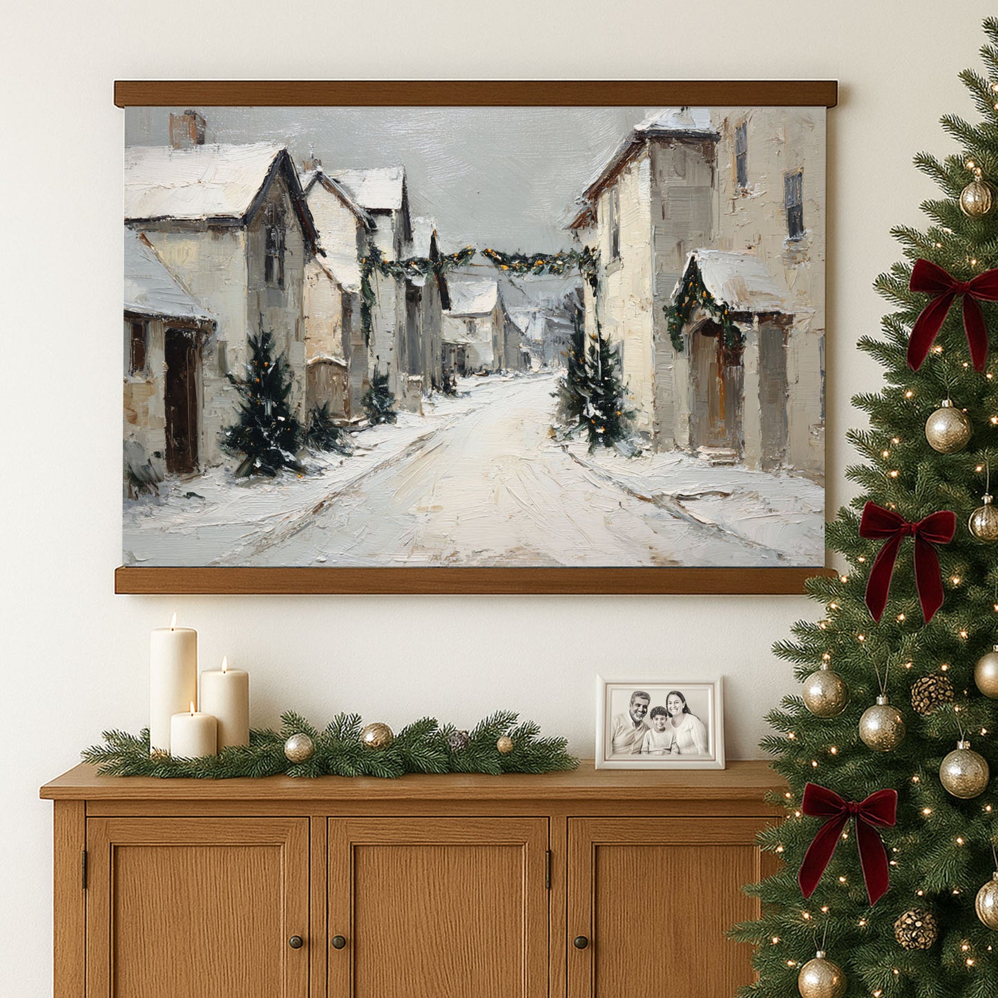 a cozy Christmas scene with a snowy village street, a decorated Christmas tree, and a framed photograph on a wooden cabinet below.