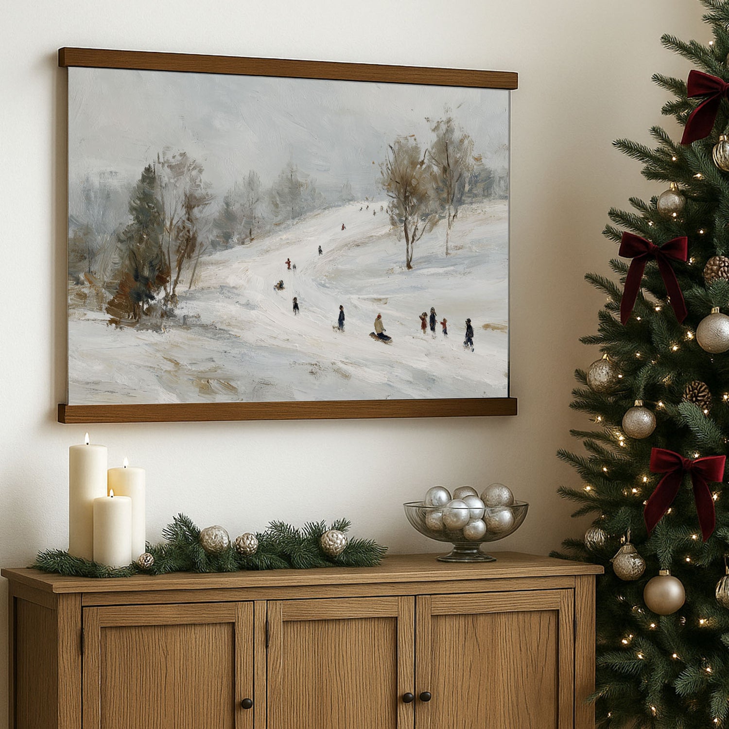 a cozy Christmas scene with a painting of people skiing on a snowy hill, a decorated Christmas tree, and a wooden cabinet with ornaments and a bowl of silver balls.