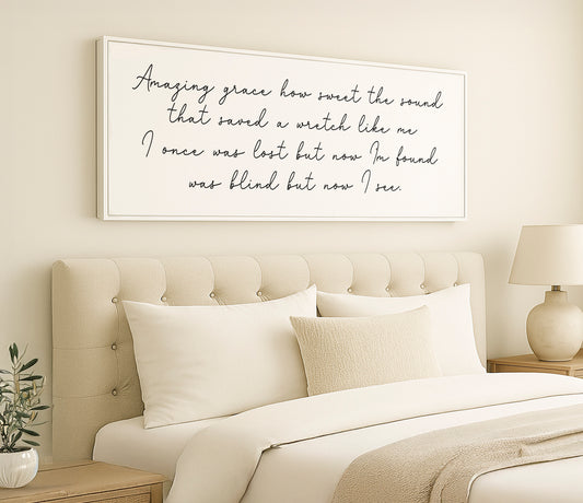 a bed with a white comforter and pillows