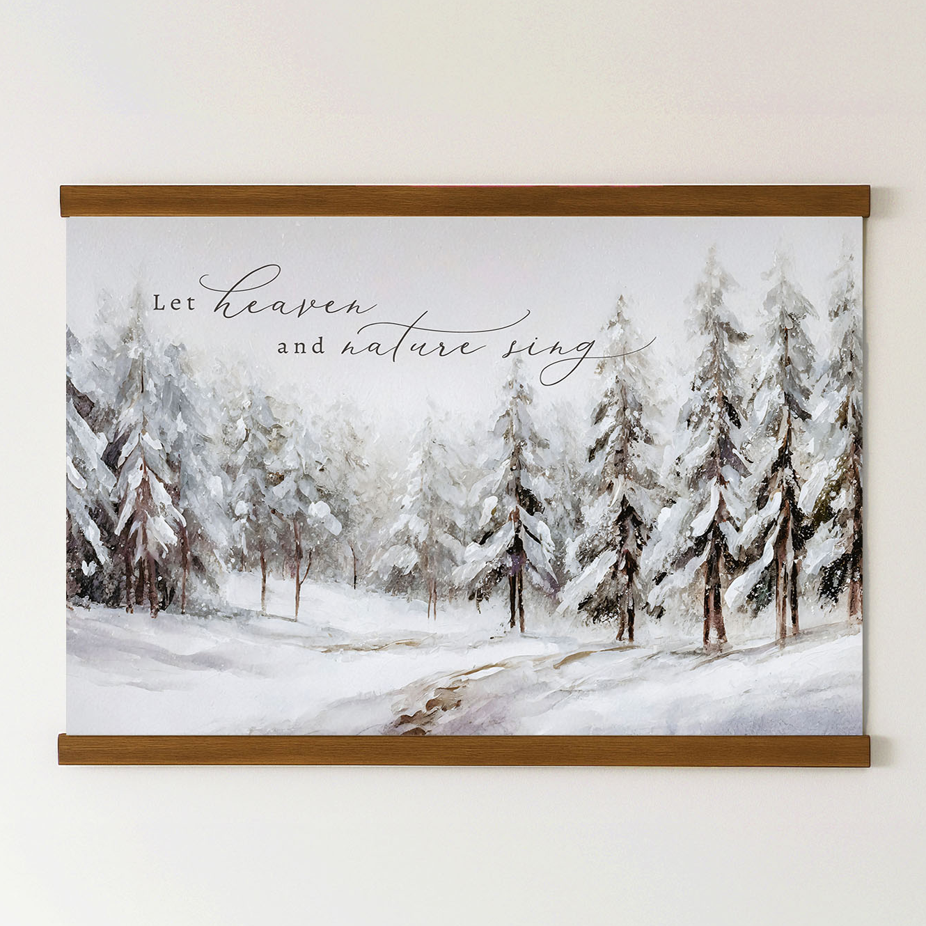 A framed painting depicting a snowy forest with pine trees covered in snow, accompanied by the text "Let heaven and nature sing" in a cursive font.
