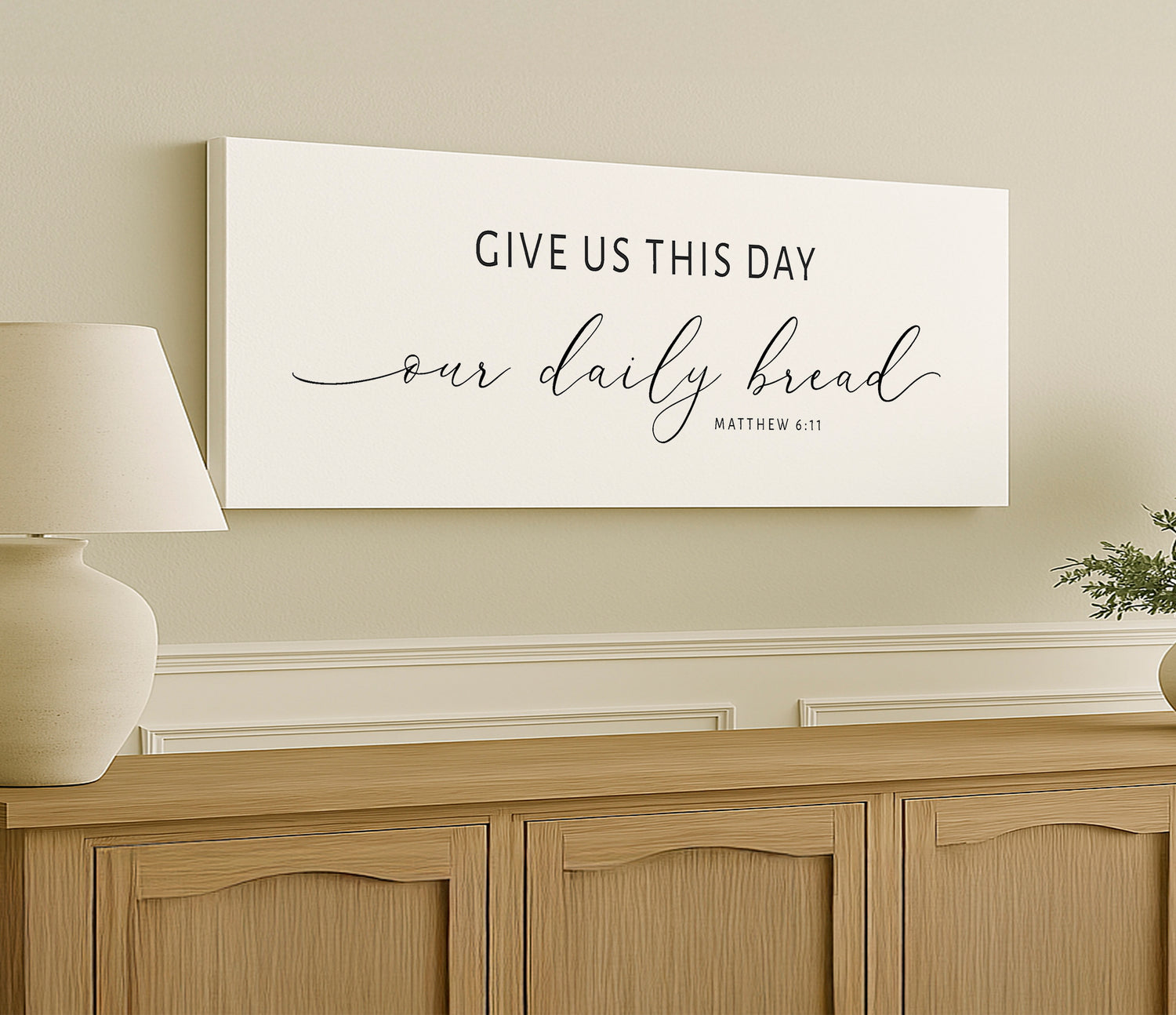 a white sign that says give us this day our daily bread