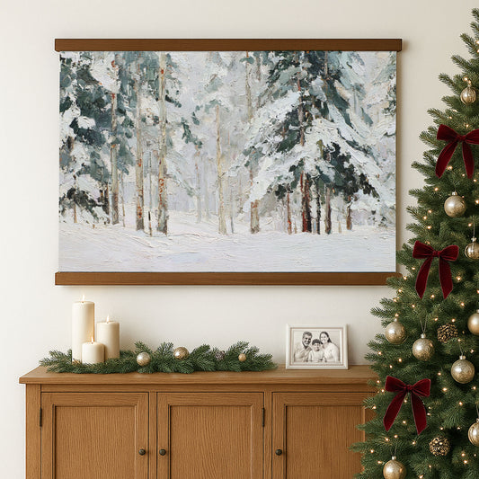 a large painting of a snowy forest hanging on a wall above a wooden cabinet, which is decorated with candles and ornaments.