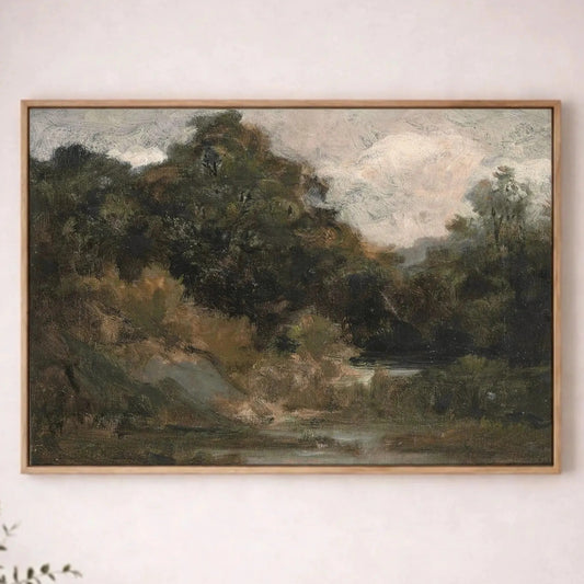 a large landscape painting hanging on a white wall above a wooden table.