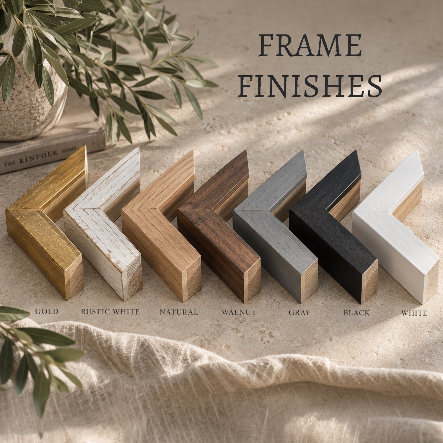 a collection of various wooden frame finishes, including gold, rustic white, natural, walnut, gray, black, and white, arranged in a row on a beige surface.
