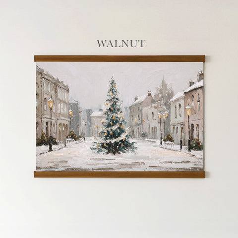 A painting of a snowy town street with a large Christmas tree in the center, surrounded by buildings and street lamps.
