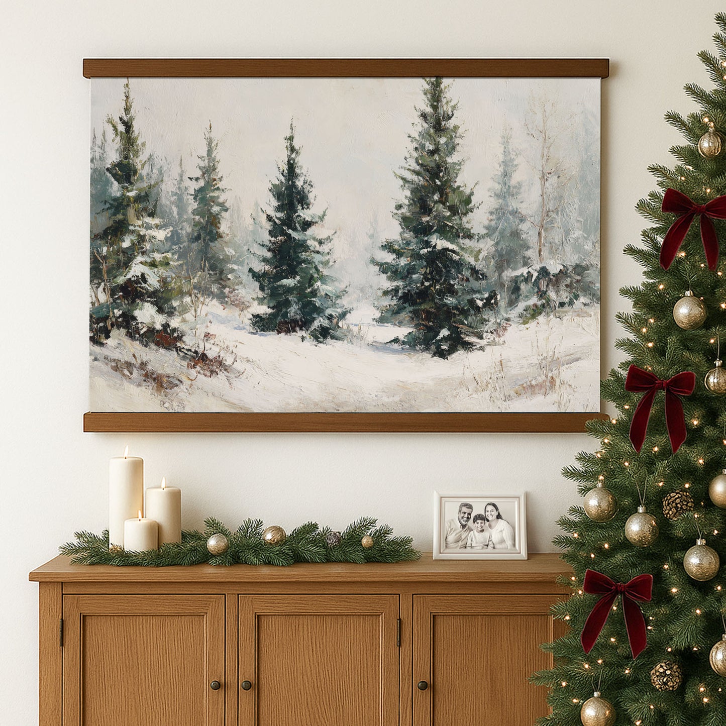 a cozy Christmas scene with a framed painting of a snowy forest, a decorated Christmas tree, and a wooden cabinet with a family photo and candles.