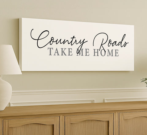 a sign that says country roads take me home