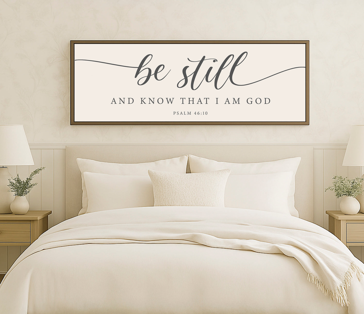 a bed with a white comforter and pillows