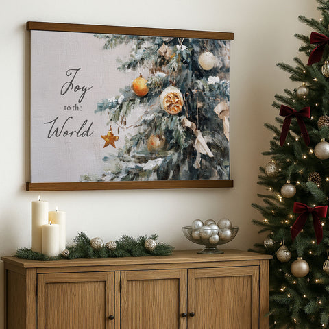 a Christmas tree decorated with ornaments, a bowl of silver balls, and a framed painting of a Christmas tree with ornaments. The painting has the text 