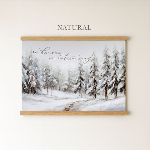 The image is a framed painting depicting a snowy forest scene with pine trees covered in snow.