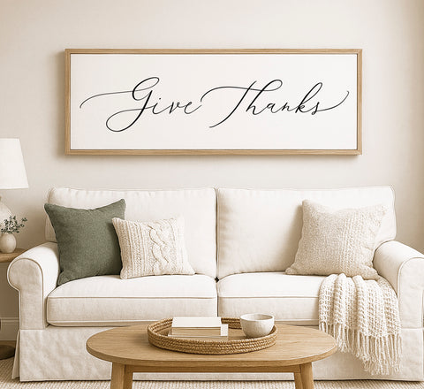 a living room with a white couch and a coffee table