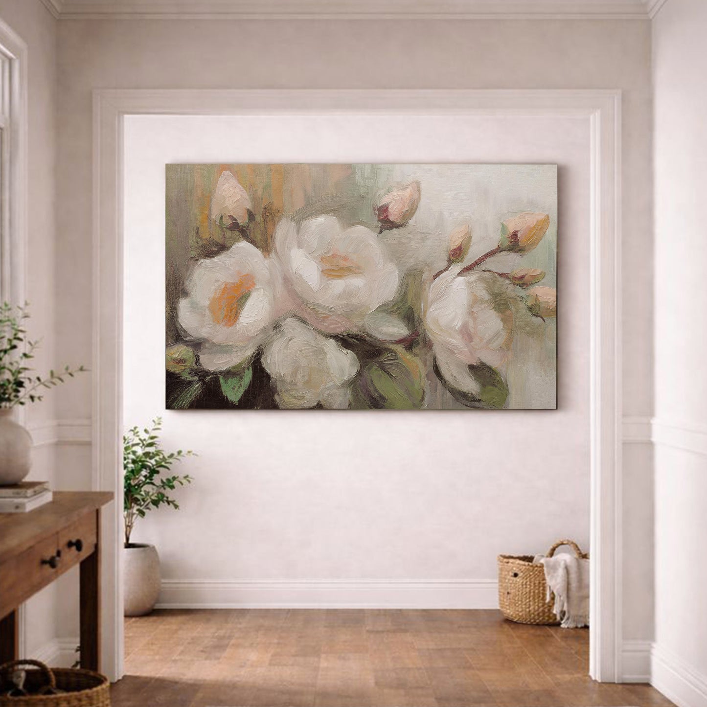 a large painting of white flowers hanging on a white wall in a room with a wooden floor.