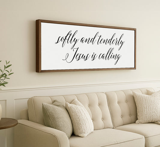 a living room with a couch and a framed sign on the wall