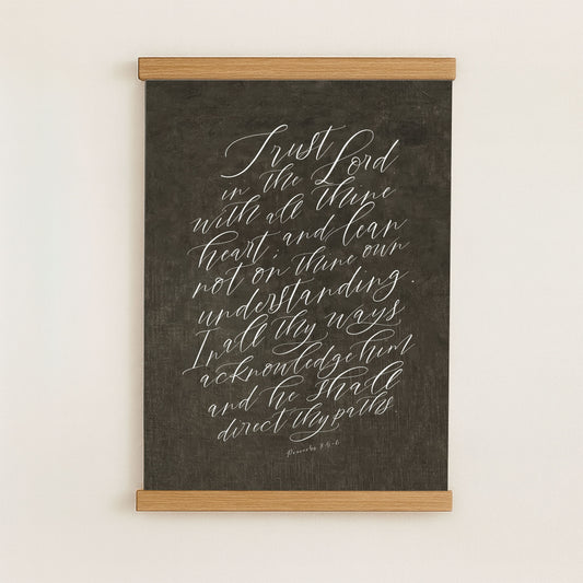 The image is a blackboard with white handwritten text that reads "Trust in the Lord with all of your heart, and lean not on them, but on the Lord."