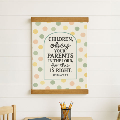 a poster with a Bible verse and a wooden frame, hanging on a white wall.