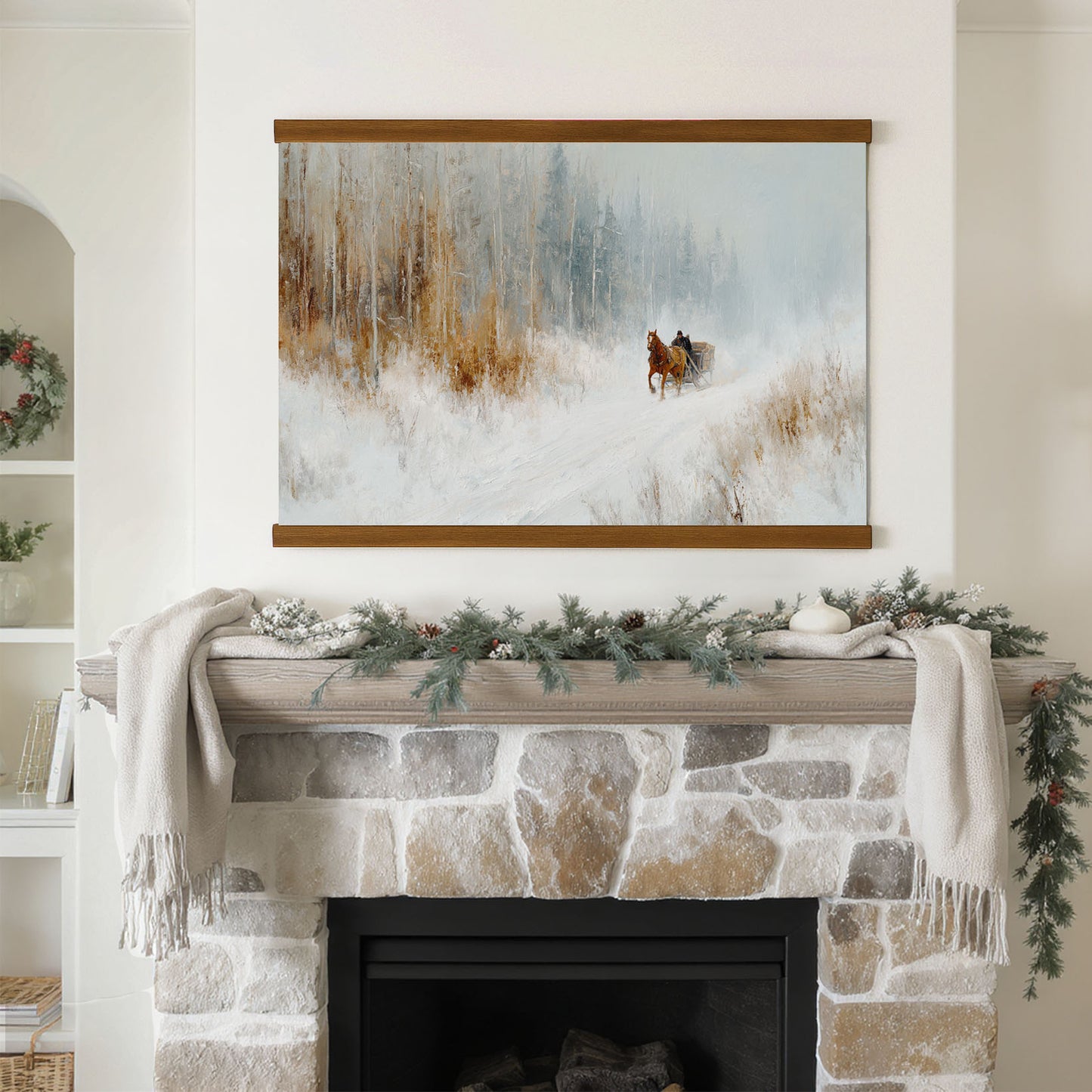 a cozy fireplace adorned with a wreath and a blanket, with a painting of a horse and carriage hanging above it.