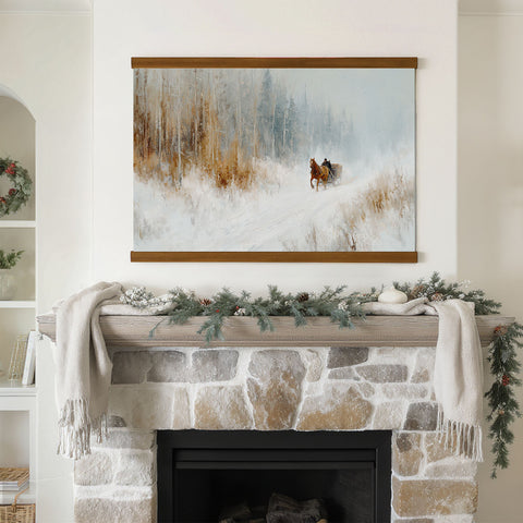 a cozy fireplace adorned with a wreath and a blanket, with a painting of a horse and carriage hanging above it.