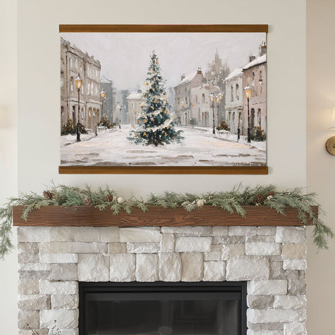 a snowy street scene with a large Christmas tree in the center, surrounded by buildings and decorated with lights.