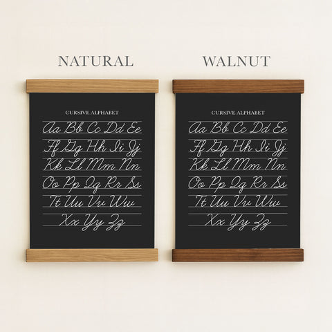 two black chalkboard-style posters, each with a different cursive alphabet. The poster on the left is labeled 