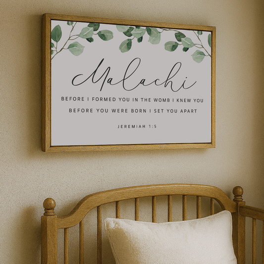 a wooden crib with a framed Bible verse above it, which reads "Malachi: Before I formed you in the womb I knew you before you were born I set you apart Jeremiah 1:5".