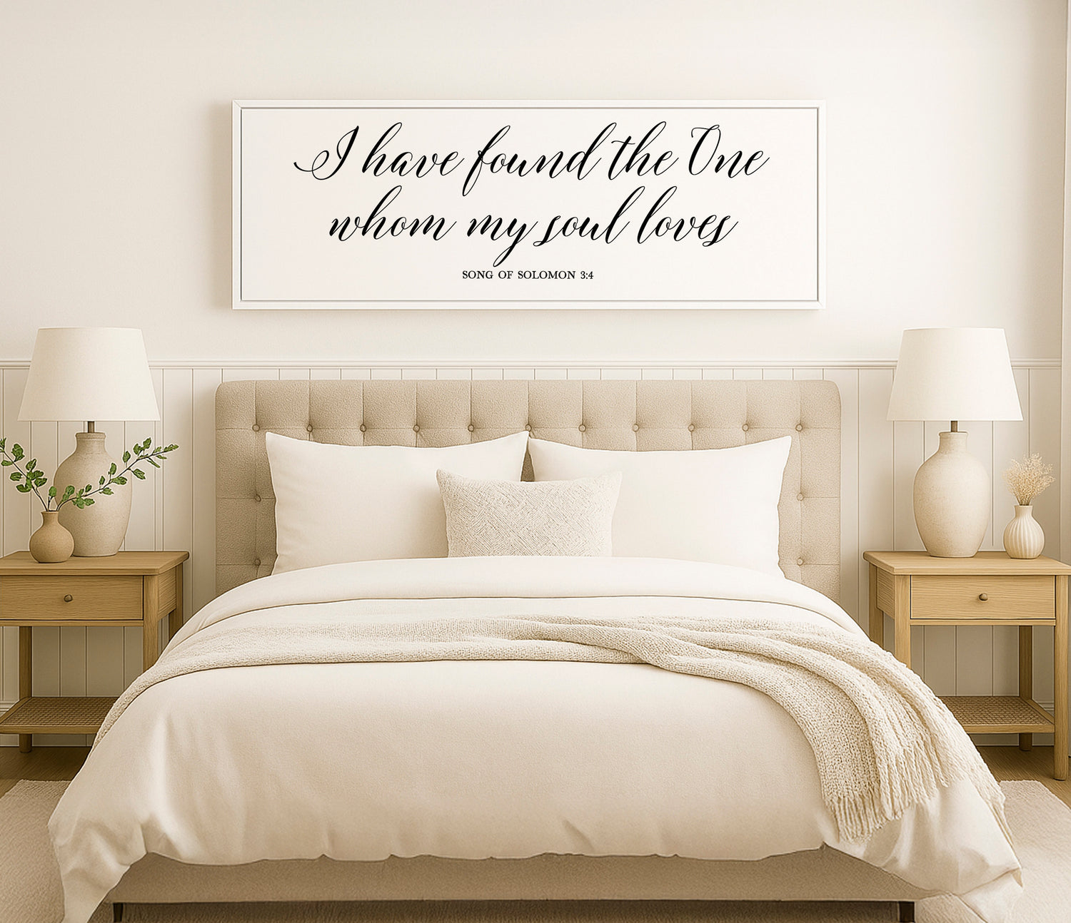 a bed with a white comforter and pillows