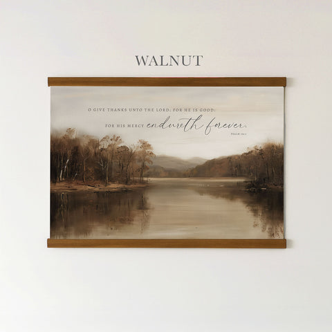The image is a framed print of a serene landscape featuring a lake surrounded by trees, with a quote from the Bible above it.