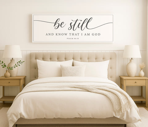a bed with a white comforter and pillows