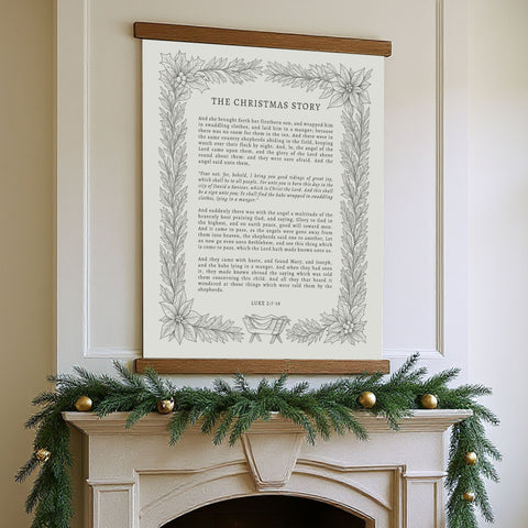 a fireplace decorated with a Christmas wreath and ornaments, with a framed text titled 