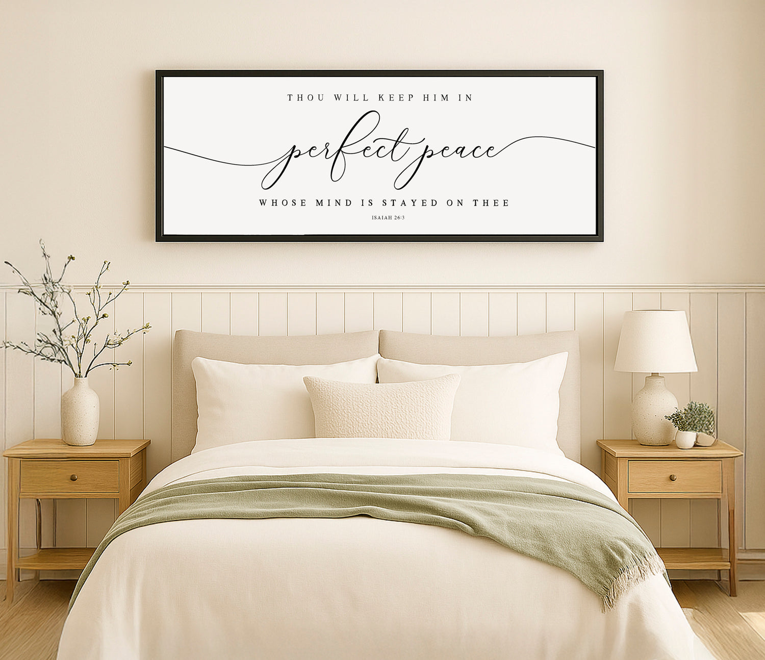 a bedroom with a bed, nightstands and a framed picture