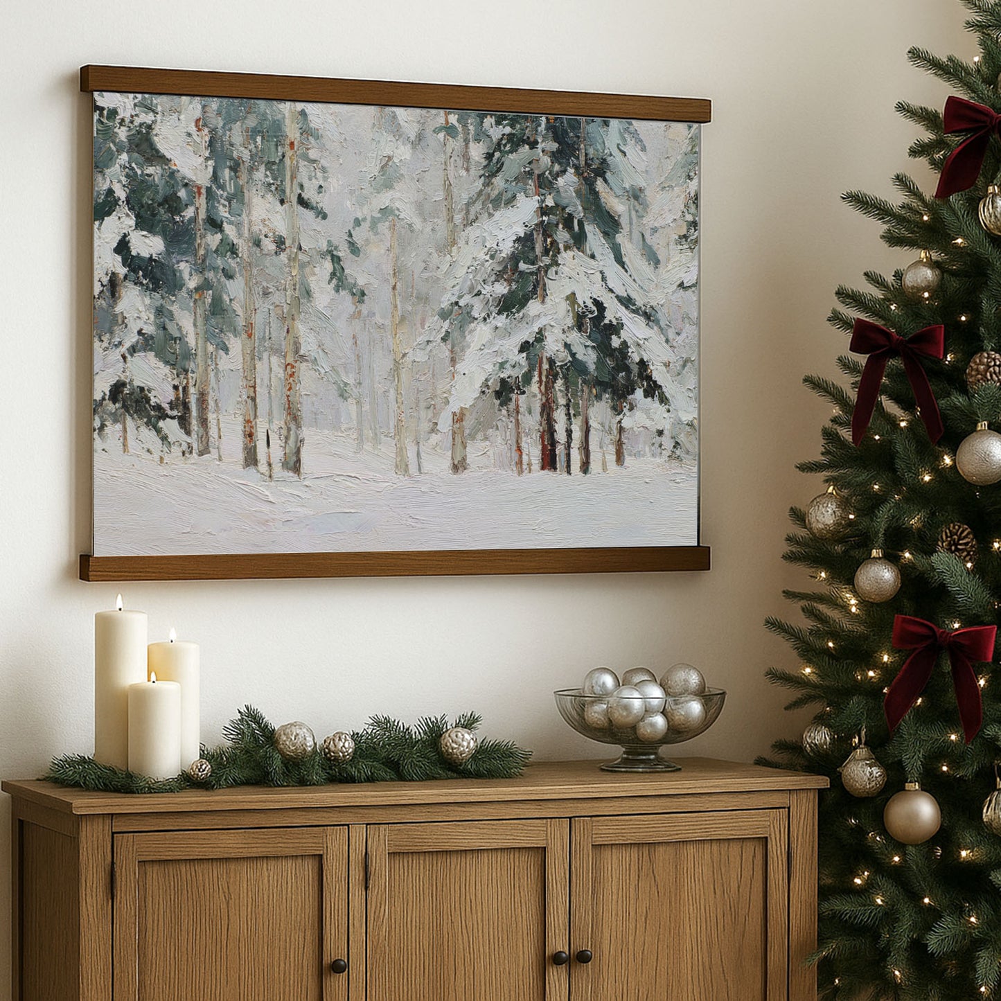 a cozy Christmas scene with a framed painting of a snowy forest hanging on a wall, a wooden cabinet below it, and a Christmas tree decorated with ornaments and a red bow.