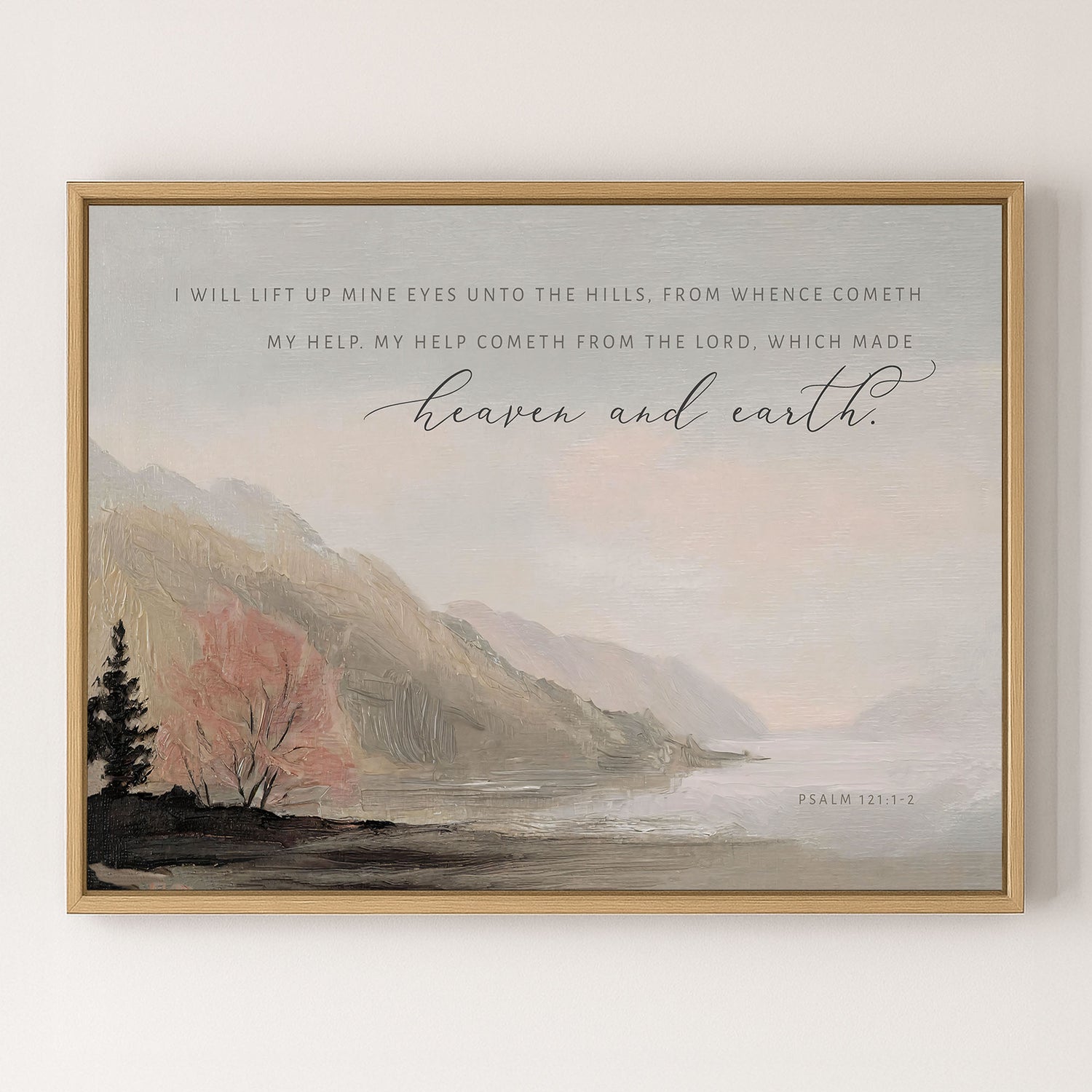 The image is a framed painting depicting a serene landscape with mountains, trees, and a body of water. The painting is framed in a wooden frame and hangs on a wall.