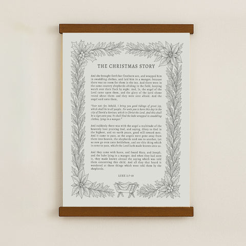 The image is a framed print of a Christmas-themed text, featuring a decorative border with a floral design.