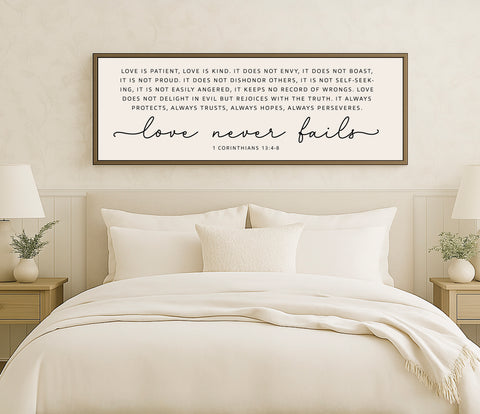 a bed with a white comforter and pillows