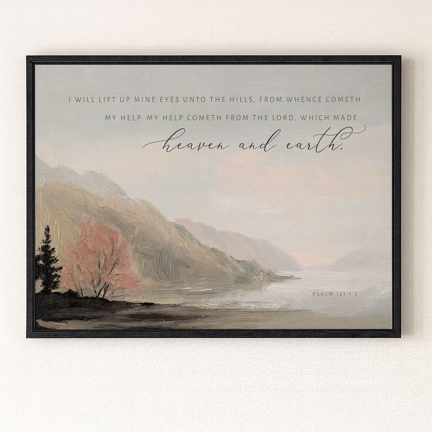 The image is a framed print featuring a serene landscape with mountains, trees, and a body of water. The text overlay provides a biblical verse from the book of Psalm 121:2, which reads "I will lift up mine eyes unto the hills, from whence comeeth my help, my help cometh from the LORD, which made heaven and earth."