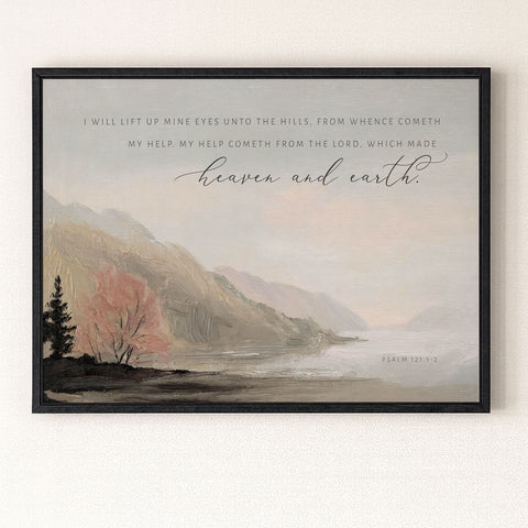 The image is a framed print featuring a serene landscape with mountains, trees, and a body of water. The text overlay provides a biblical verse from the book of Psalm 121:2, which reads 