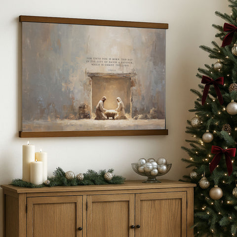 a wooden cabinet with a Christmas tree to the right, a painting of the Nativity scene above it, and a bowl of silver ornaments on the cabinet.
