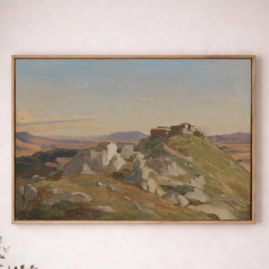 a large landscape painting hanging on a wall, depicting a mountainous terrain with a building on top.