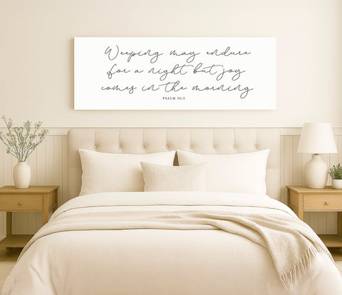 a bed with a white comforter and pillows