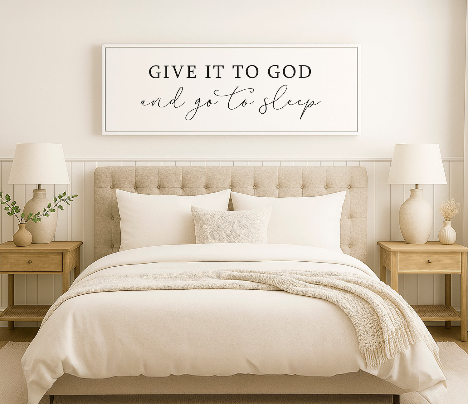 a bed with a white comforter and pillows