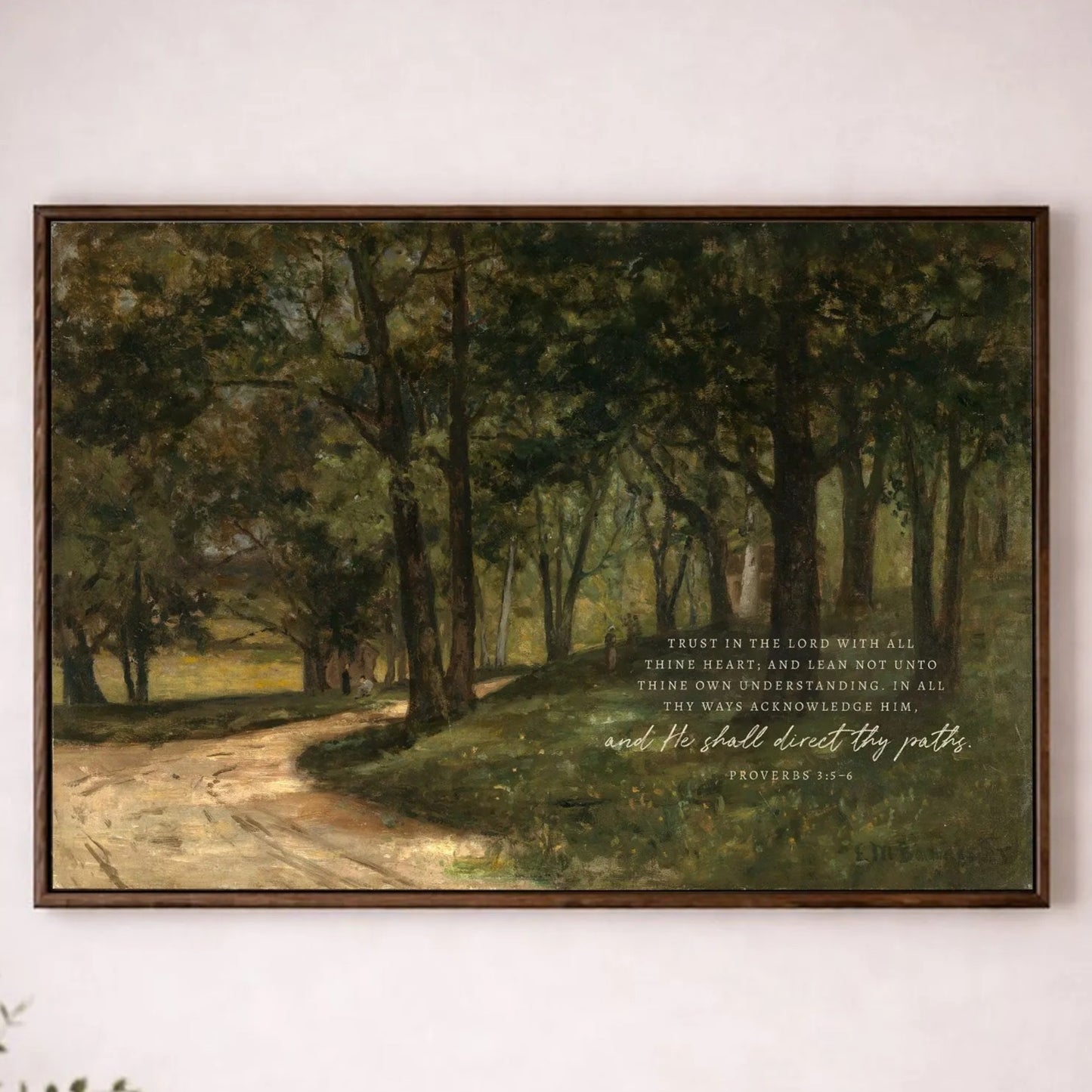 a painting of a forest scene hanging on a white wall, with a quote from the Bible below it.